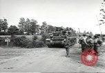Image of United States troops greeted by French civilians Sainte-Marie-du-Mont France, 1944, second 36 stock footage video 65675060425