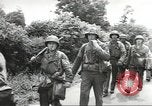 Image of United States troops greeted by French civilians Sainte-Marie-du-Mont France, 1944, second 39 stock footage video 65675060425