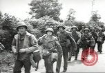 Image of United States troops greeted by French civilians Sainte-Marie-du-Mont France, 1944, second 40 stock footage video 65675060425