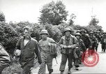 Image of United States troops greeted by French civilians Sainte-Marie-du-Mont France, 1944, second 42 stock footage video 65675060425
