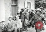 Image of United States troops greeted by French civilians Sainte-Marie-du-Mont France, 1944, second 46 stock footage video 65675060425