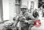 Image of United States troops greeted by French civilians Sainte-Marie-du-Mont France, 1944, second 48 stock footage video 65675060425