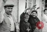 Image of United States troops greeted by French civilians Sainte-Marie-du-Mont France, 1944, second 54 stock footage video 65675060425