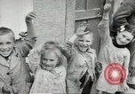 Image of United States troops greeted by French civilians Sainte-Marie-du-Mont France, 1944, second 58 stock footage video 65675060425