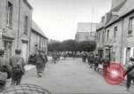 Image of United States troops greeted by French civilians Sainte-Marie-du-Mont France, 1944, second 60 stock footage video 65675060425