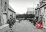 Image of United States troops greeted by French civilians Sainte-Marie-du-Mont France, 1944, second 61 stock footage video 65675060425