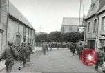 Image of United States troops greeted by French civilians Sainte-Marie-du-Mont France, 1944, second 62 stock footage video 65675060425