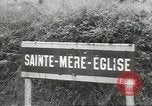 Image of American soldiers enter Sainte-Mere-Eglise in World War II Normandy France, 1944, second 3 stock footage video 65675060426