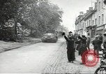 Image of American soldiers enter Sainte-Mere-Eglise in World War II Normandy France, 1944, second 5 stock footage video 65675060426