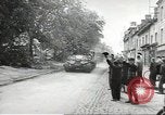 Image of American soldiers enter Sainte-Mere-Eglise in World War II Normandy France, 1944, second 6 stock footage video 65675060426