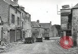 Image of American soldiers enter Sainte-Mere-Eglise in World War II Normandy France, 1944, second 10 stock footage video 65675060426