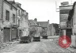Image of American soldiers enter Sainte-Mere-Eglise in World War II Normandy France, 1944, second 11 stock footage video 65675060426