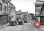 Image of American soldiers enter Sainte-Mere-Eglise in World War II Normandy France, 1944, second 12 stock footage video 65675060426