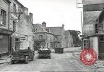 Image of American soldiers enter Sainte-Mere-Eglise in World War II Normandy France, 1944, second 13 stock footage video 65675060426