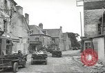 Image of American soldiers enter Sainte-Mere-Eglise in World War II Normandy France, 1944, second 14 stock footage video 65675060426