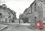 Image of American soldiers enter Sainte-Mere-Eglise in World War II Normandy France, 1944, second 19 stock footage video 65675060426