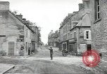 Image of American soldiers enter Sainte-Mere-Eglise in World War II Normandy France, 1944, second 21 stock footage video 65675060426
