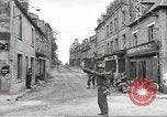 Image of American soldiers enter Sainte-Mere-Eglise in World War II Normandy France, 1944, second 25 stock footage video 65675060426