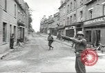 Image of American soldiers enter Sainte-Mere-Eglise in World War II Normandy France, 1944, second 26 stock footage video 65675060426
