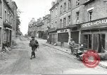 Image of American soldiers enter Sainte-Mere-Eglise in World War II Normandy France, 1944, second 27 stock footage video 65675060426