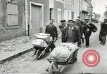 Image of American soldiers enter Sainte-Mere-Eglise in World War II Normandy France, 1944, second 29 stock footage video 65675060426