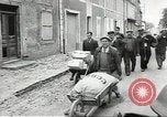 Image of American soldiers enter Sainte-Mere-Eglise in World War II Normandy France, 1944, second 31 stock footage video 65675060426