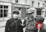 Image of American soldiers enter Sainte-Mere-Eglise in World War II Normandy France, 1944, second 33 stock footage video 65675060426