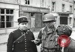 Image of American soldiers enter Sainte-Mere-Eglise in World War II Normandy France, 1944, second 34 stock footage video 65675060426