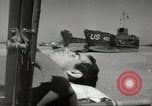 Image of Evacuating wounded United States soldiers from Omaha Beach Normandy France, 1944, second 39 stock footage video 65675060432
