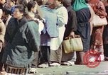 Image of Japanese citizens in poverty after World War 2 defeat Tokyo Japan, 1945, second 39 stock footage video 65675060711