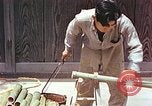 Standbild japanische Arbeiter Kyoto Japan, 1946, aus Sekunde 9 historischem Filmmaterial Videoclip 65675060731