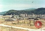 Image attaque incendiaires des dommages Tsuruga Japon, 1946, de la seconde 62 séquences d'archives historiques vidéo 65675060739