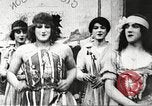 Image of World War 1 US soldiers watching drag queens perform France, 1918, second 15 stock footage video 65675061256
