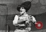 Image of World War 1 US soldiers watching drag queens perform France, 1918, second 34 stock footage video 65675061256
