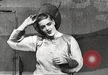 Image of World War 1 US soldiers watching drag queens perform France, 1918, second 37 stock footage video 65675061256