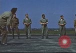 Image of Airmen amuse themselves pitching coins United Kingdom, 1943, second 58 stock footage video 65675061382