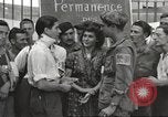 Image of U.S. Paratrooper talks with  French Forces of Interior Saint Tropez France, 1944, second 32 stock footage video 65675061547