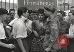 Image of U.S. Paratrooper talks with  French Forces of Interior Saint Tropez France, 1944, second 50 stock footage video 65675061547
