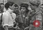 Image of U.S. Paratrooper talks with  French Forces of Interior Saint Tropez France, 1944, second 55 stock footage video 65675061547