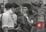 Image of U.S. Paratrooper talks with  French Forces of Interior Saint Tropez France, 1944, second 58 stock footage video 65675061547