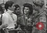 Image of U.S. Paratrooper talks with  French Forces of Interior Saint Tropez France, 1944, second 62 stock footage video 65675061547