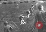 Image of American infantry wading through water Korea, 1953, second 1 stock footage video 65675061714