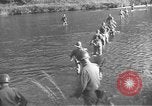 Image of American infantry wading through water Korea, 1953, second 3 stock footage video 65675061714