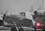 Image of Douglas SBD Dauntless aircraft start and taxi Pearl Harbor Hawaii USA, 1942, second 60 stock footage video 65675061841