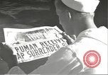 Image of United States sailors learn about end of World War II Hawaii USA, 1945, second 19 stock footage video 65675061871