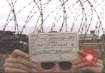 Image of view through barbed wire at airbase operations Vietnam, 1967, second 3 stock footage video 65675061936