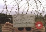 Image of view through barbed wire at airbase operations Vietnam, 1967, second 5 stock footage video 65675061936