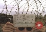 Image of view through barbed wire at airbase operations Vietnam, 1967, second 6 stock footage video 65675061936