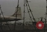 Image of view through barbed wire at airbase operations Vietnam, 1967, second 42 stock footage video 65675061936