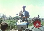 Image of Chaplain ministering to 199th Light Infantry Brigade South Vietnam, 1968, second 12 stock footage video 65675062056